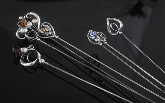 Seven assorted early 20th century Charles Horner silver mounted hat pins, longest 24.1cm.